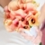 boeket · bloemen · oranje · handen · jonge · vrouw - stockfoto © Dinga