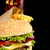 Cropped image of cheeseburger,french fries,glass of cola on black stock photo © dla4