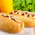 Hotdog with bottle of mustard and ketchup with salad on wooden d stock photo © dla4