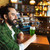 man drinking green beer at bar or pub stock photo © dolgachov