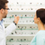 optician showing glasses to woman at optics store stock photo © dolgachov