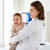 doctor or pediatrician holding baby at clinic stock photo © dolgachov