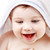 feliz · bebé · túnica · cabeza · blanco · cara - foto stock © dolgachov