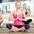 group of smiling women meditating in yoga pose stock photo © dolgachov