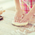 close up of female hands kneading dough at home stock photo © dolgachov