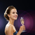 smiling woman holding glass of sparkling wine stock photo © dolgachov