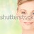 close up of beautiful young woman face stock photo © dolgachov