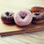 close up of glazed donuts pile on wooden table stock photo © dolgachov