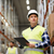 man with clipboard in safety vest at warehouse stock photo © dolgachov
