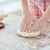 close up of female hands kneading dough at home stock photo © dolgachov