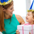 mother and daughter in blue hats with favor horns stock photo © dolgachov