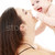 laughing blue-eyed baby playing with mom stock photo © dolgachov