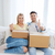happy couple with boxes showing thumbs up at home stock photo © dolgachov