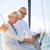 senior couple with tablet pc on sail boat or yacht stock photo © dolgachov