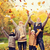 happy family playing with autumn leaves in park stock photo © dolgachov