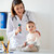 doctor with baby and otoscope at clinic stock photo © dolgachov
