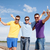 happy friends with beer bottles on beach stock photo © dolgachov