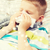ill boy blowing nose with tissue at home stock photo © dolgachov