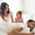 happy family waking up in bed at home stock photo © dolgachov