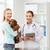 happy woman with dog and doctor at vet clinic stock photo © dolgachov