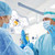 surgeons in operating room at hospital stock photo © dolgachov