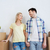 smiling couple with big boxes moving to new home stock photo © dolgachov