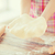 close up of female hands holding bread dough stock photo © dolgachov