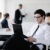 Portrait of a handsome young business man with colleagues in background stock photo © dotshock