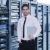 businessman with laptop in network server room stock photo © dotshock