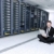 businessman with laptop in network server room stock photo © dotshock