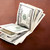 Folded 100 US$  Bills Stack on Brown Background stock photo © eldadcarin