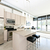 Modern condo kitchen and living room stock photo © elenaphoto