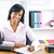 Smiling black businesswoman at desk stock photo © elenaphoto