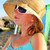 tinilány · visel · kalap · napszemüveg · megnyugtató · tengerpart - stock fotó © elenaphoto