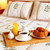 Breakfast on a bed in a hotel room stock photo © elenaphoto