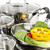 Stainless steel pots and pans with vegetables stock photo © elenaphoto
