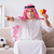 Young arab man watching football sitting on sofa stock photo © Elnur