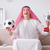 Young arab man watching football sitting on sofa stock photo © Elnur