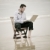 business man sitting on a chair on the beach with laptop stock photo © epstock