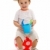 Little boy sitting on dotted ball, holding sandbox toys stock photo © erierika