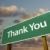 Thank You Green Road Sign Over Clouds stock photo © feverpitch