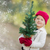 Baby Girl In Mittens Holding Small Christmas Tree with Snow Effe stock photo © feverpitch