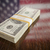 Thousands of Dollars with Reflection of American Flag on Table stock photo © feverpitch