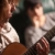 Young Musician Plays His Acoustic Guitar as Friend Listens stock photo © feverpitch