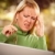 Grimacing Woman Using laptop Suffering a Headache stock photo © feverpitch