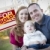 Happy Young Family in Front of Sold Real Estate Sign stock photo © feverpitch