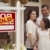 Hispanic Family in Front of Home with Sold Real Estate Sign stock photo © feverpitch