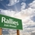 Rallies Green Road Sign Against Clouds stock photo © feverpitch