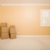 Moving Boxes in Empty Room with Copy Space on Wall stock photo © feverpitch