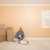 Pretty Woman and Dogs with Moving Boxes in Room on Floor stock photo © feverpitch